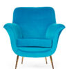 Old antique sixties retro arm chair in blue upholstery